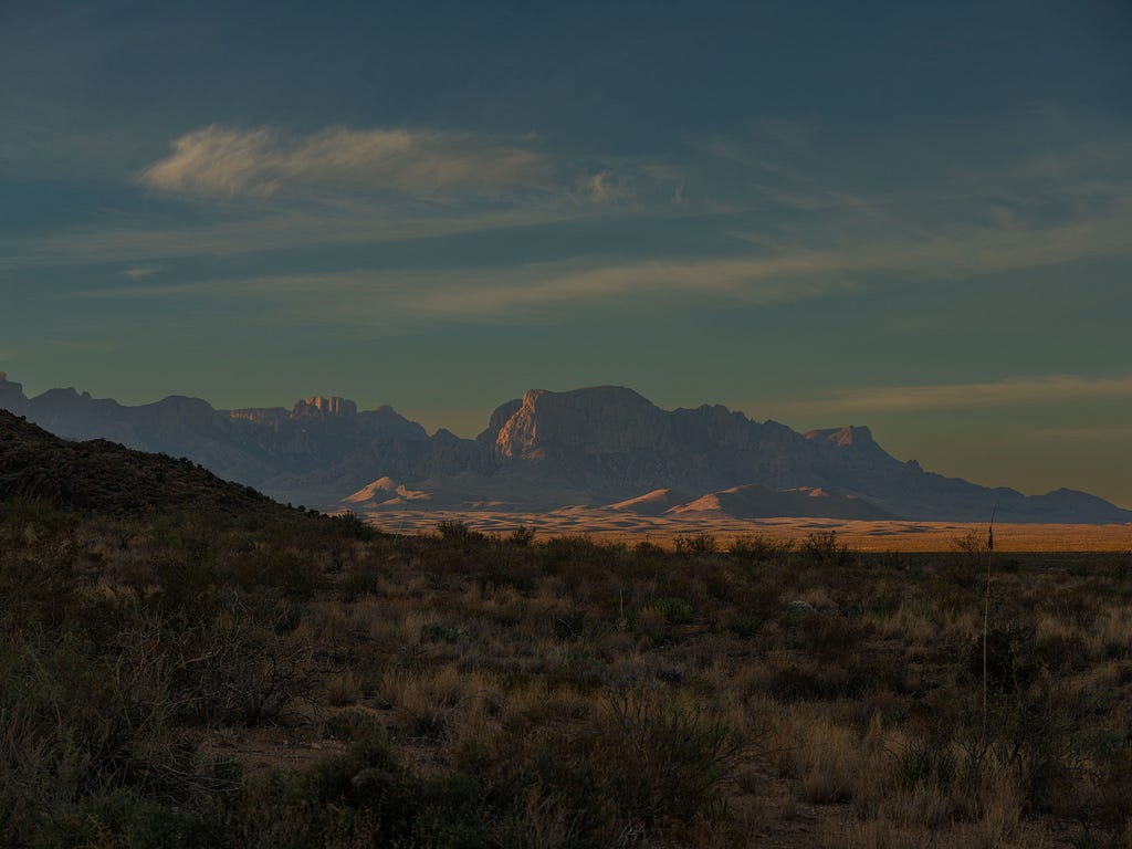 Distant mountains seen across sprawling desert