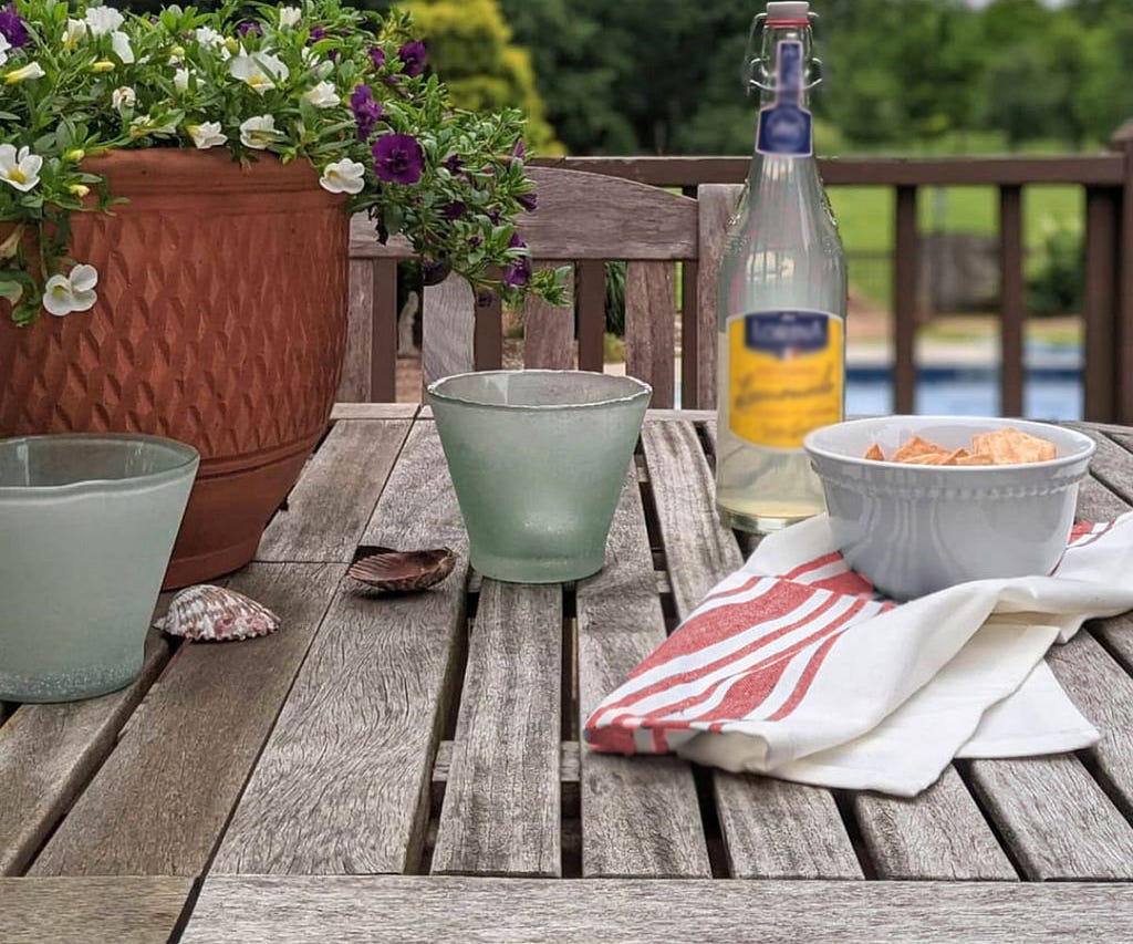 Patterned kitchen towels displayed in a rustic kitchen setting