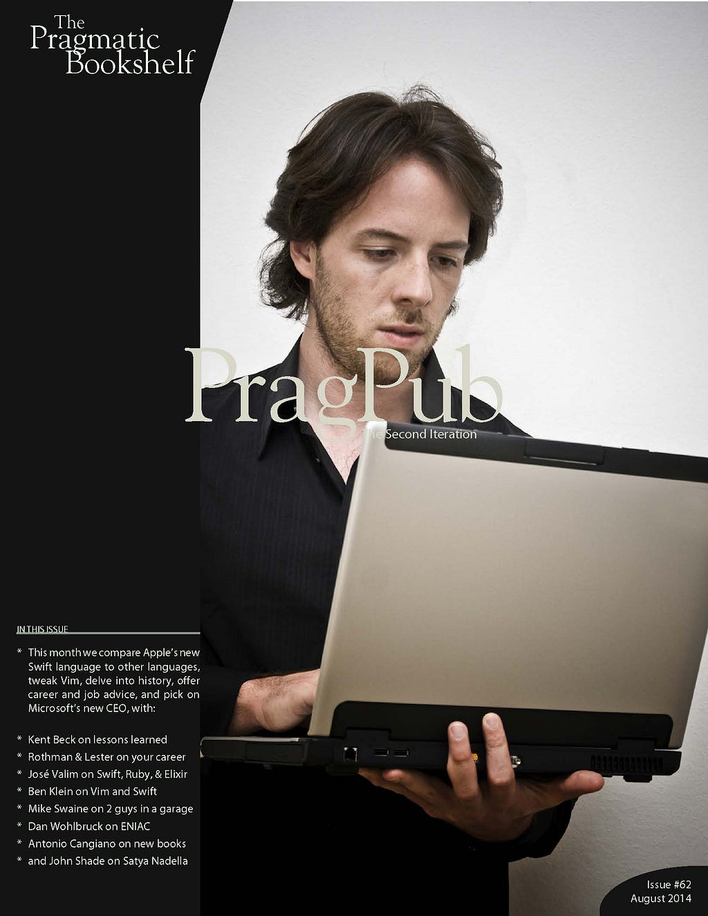 White male with brown hair looking down at a laptop