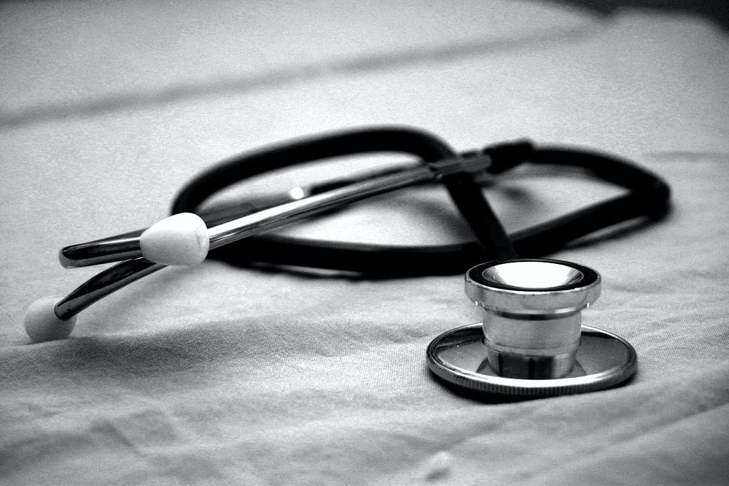 Black and white image with a stethoscope.