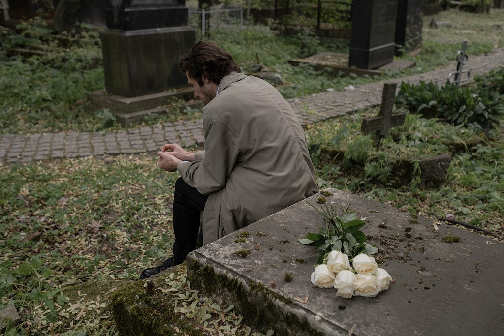 a man at a graveyard