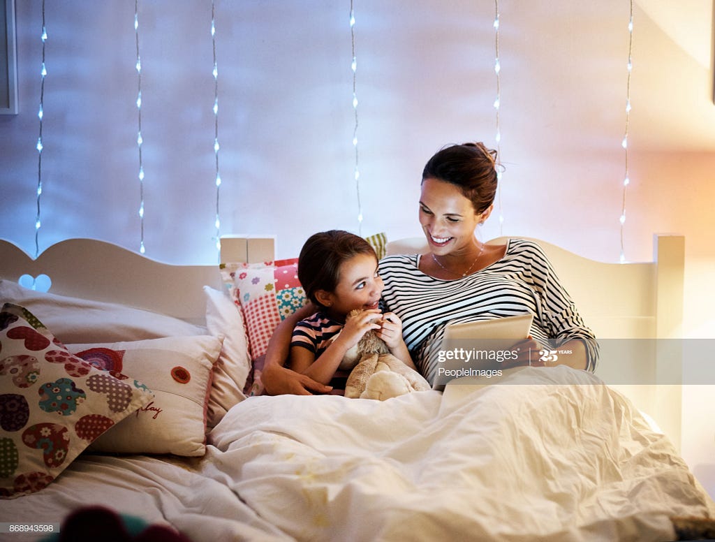 Mom, 5-year-old daughter, bed, storytelling