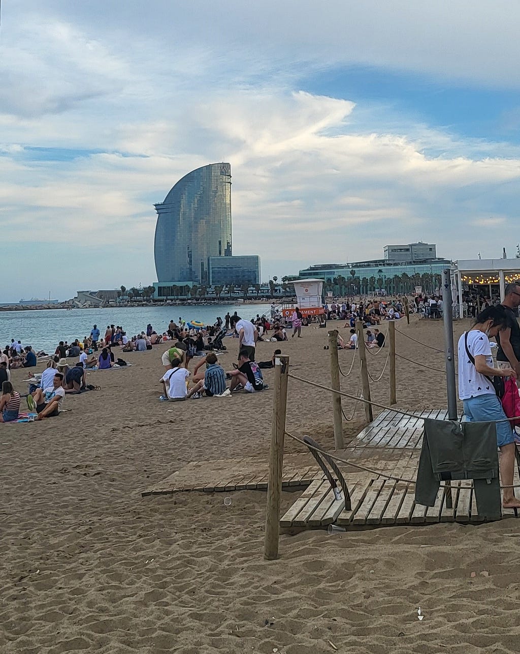 Sunset magic at Barceloneta, silhouetting the W Hotel