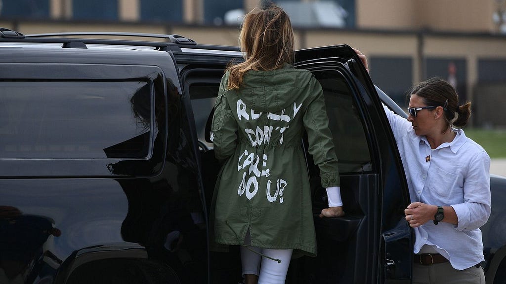 Melania Trump wearing a jacket that reads “I REALLY DON’T CARE, DO U?”.