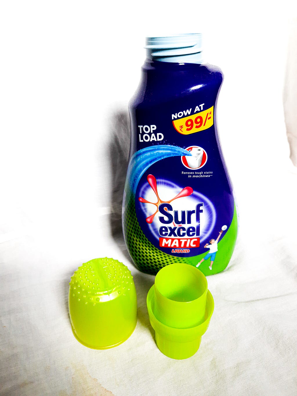 bottle of Surf Excel Matic with caps opened