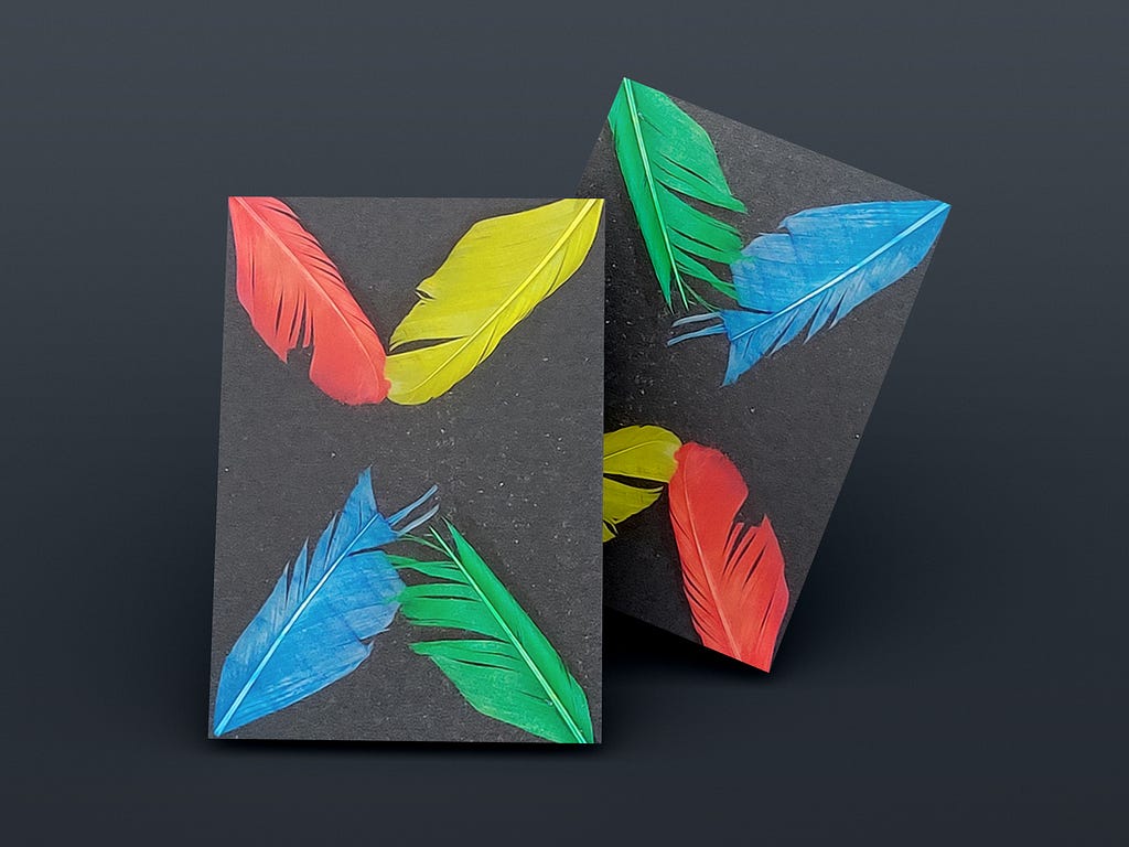 4 feathers (red, yellow, blue, green) on the 4 corners of paper.