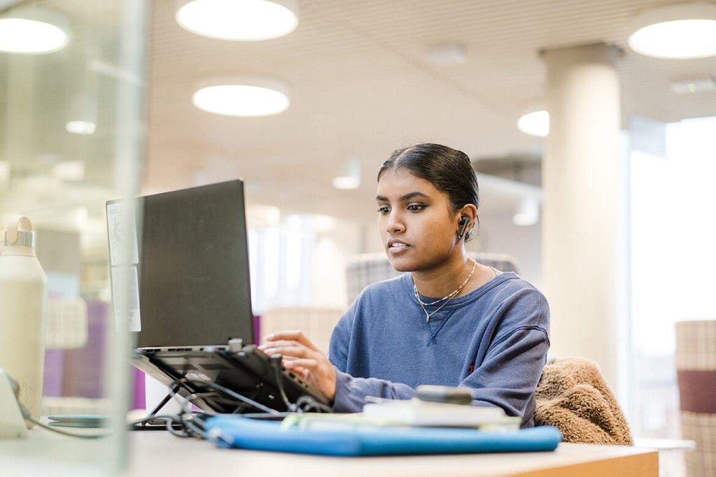 A student studying on their laptop.