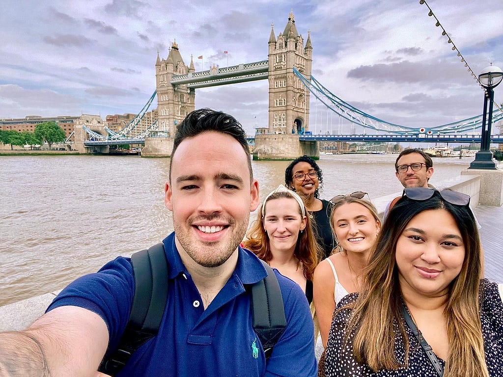 The Digital and Phone Services team are pictured together in front of Tower Bridge in London.