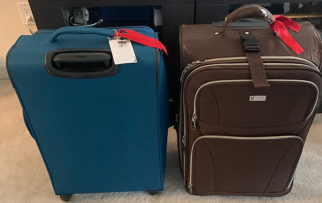 The missing suitcases with a red ribbon identifier