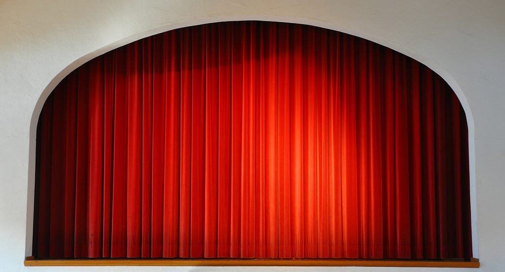 A bright red theater curtain.