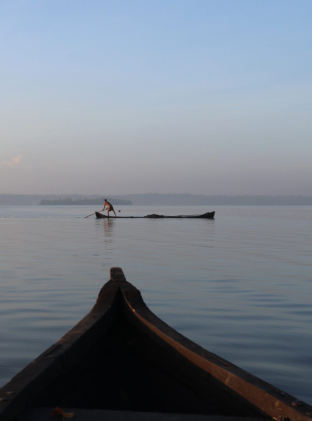 Man pushing a boat