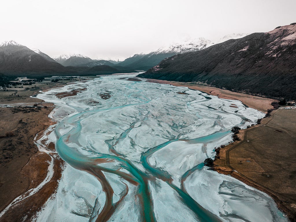 A photograph of a braided river, connecting waterways, in Aotearoa New Zealand.