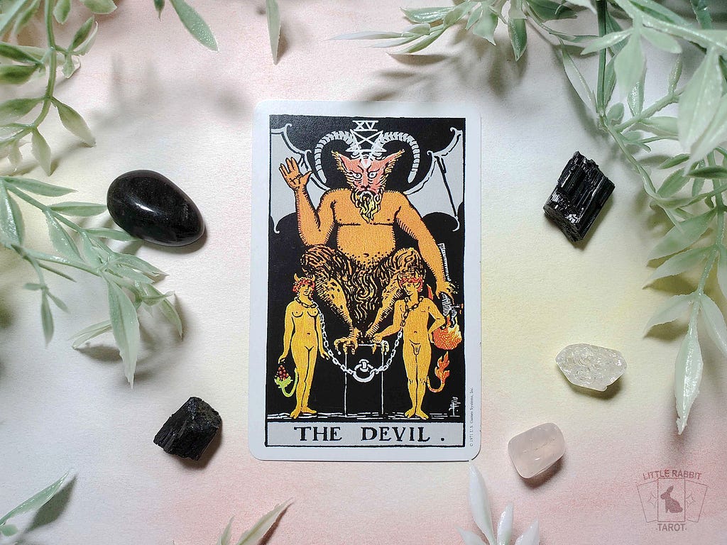 A photo of ‘The Devil’ tarot card from the RWS pocket edition deck.