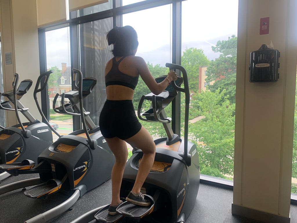 A women using the elliptical