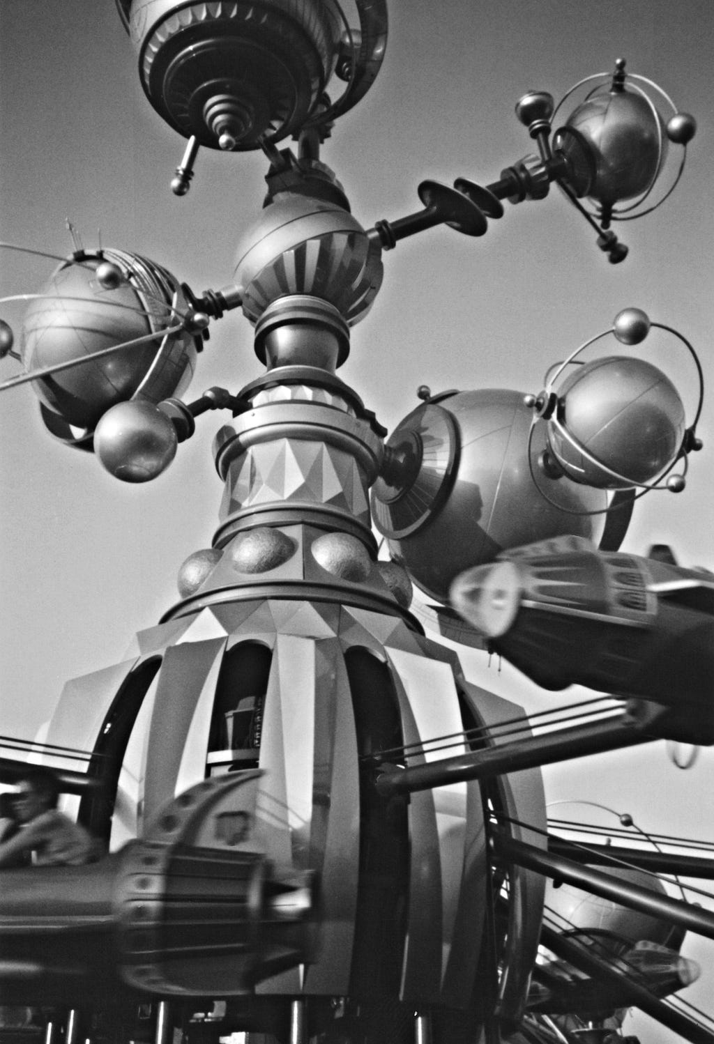 A carnival ride resembling a complicated orrery at Disneyland in Paris