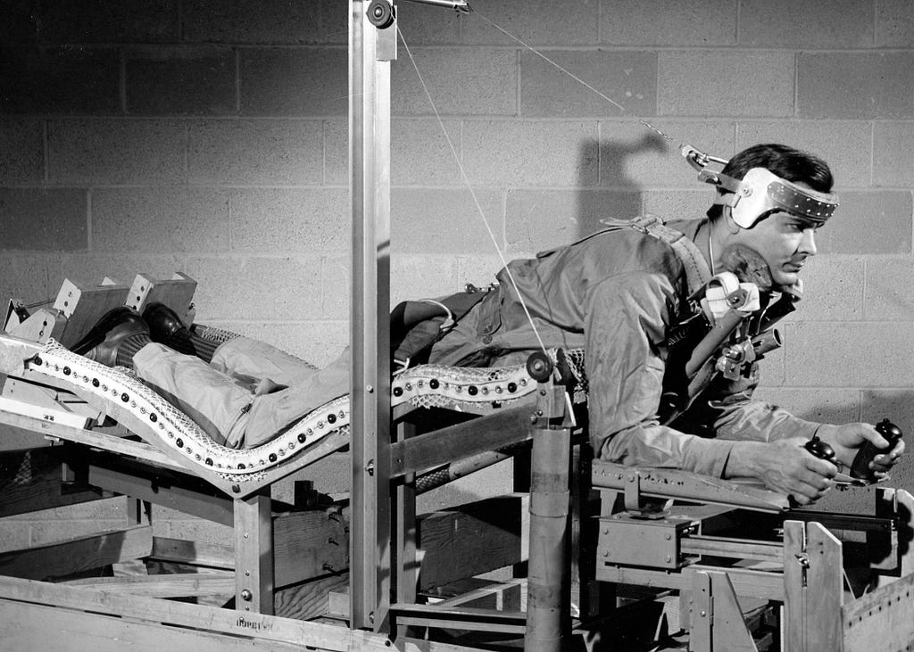U.S. Air Force Aeromedical Laboratory scientists testing a prone-position pilot bed, on February 3, 1949.