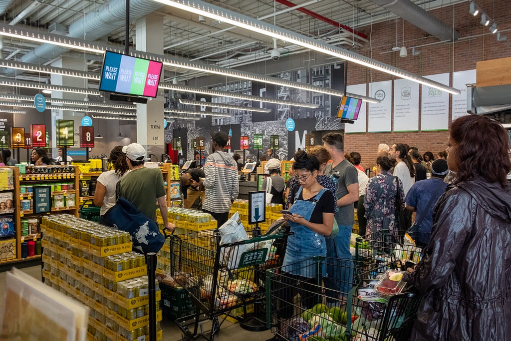 Shoppers wait in line at Whole Foods in Harlem, NY. September 13, 2019.  Brandon Drenon.