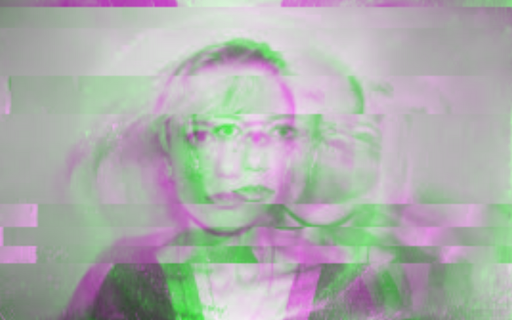 Glitched image of a women shaking her head