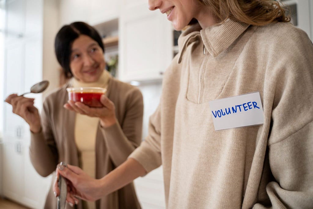 A mother-daughter duo volunteering for charity.