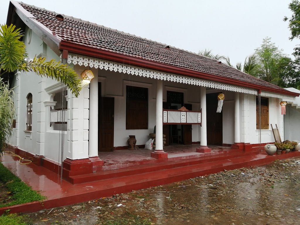 A colonial house with a front porch