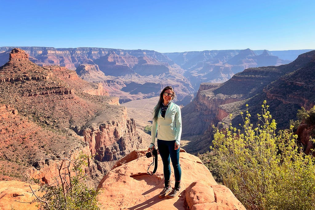 Woman solo hiker at an overlook on Bright Angel Trail in the Grand Canyon