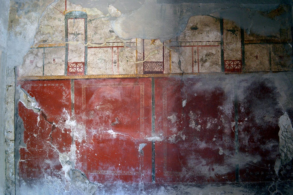 Wall fresco inside a house in Pompeii — Italy.