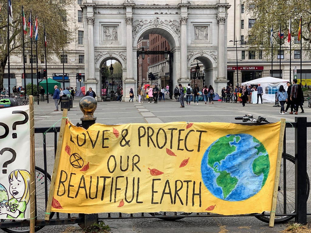 Banner saying “Love & Protect Our Beautiful Earth”