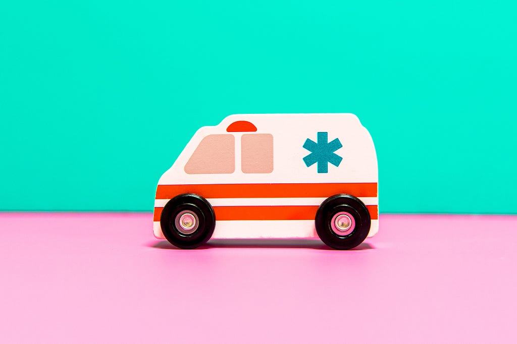 Illustration showing a wooden toy ambulance.