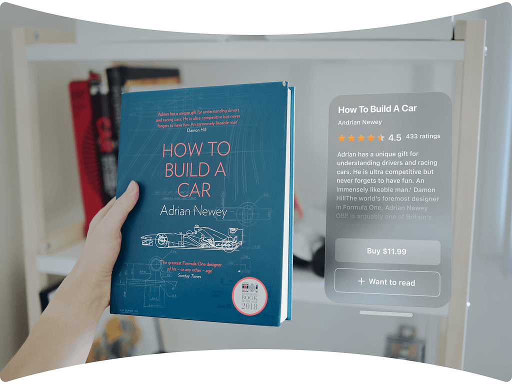 A person holding a real book titled ‘How To Build A Car’ by Adrian Newey, with an AR overlay showing a rating of 4.5 stars, reviews, and options to buy or add to a reading list.