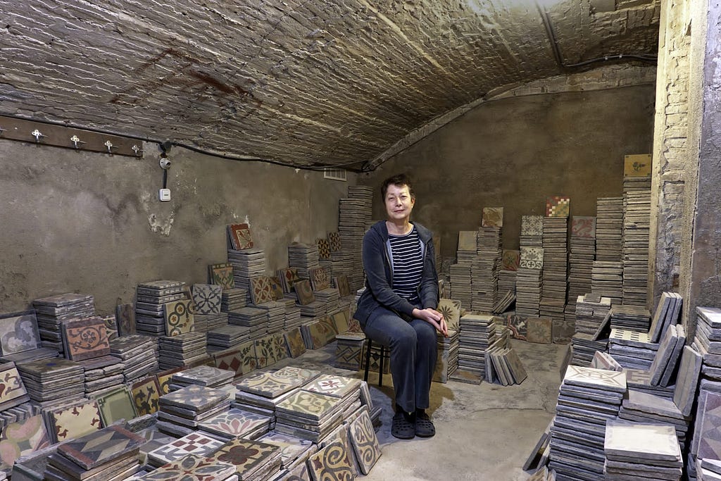 Benedicte Bodard in her basement studio with Catalan modernist tiles.