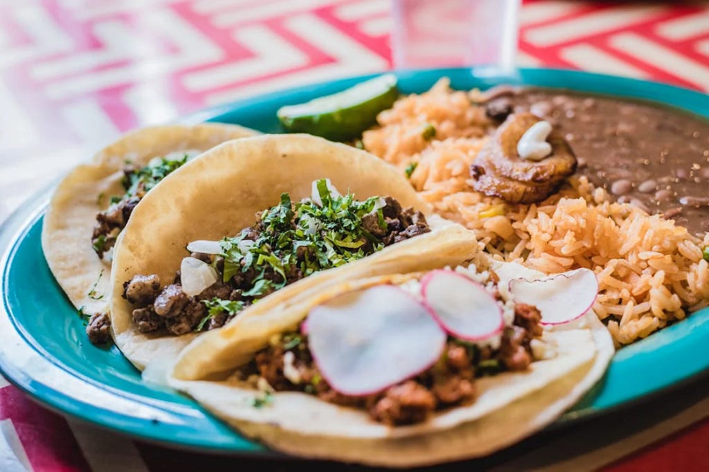 3 tacos in a plate