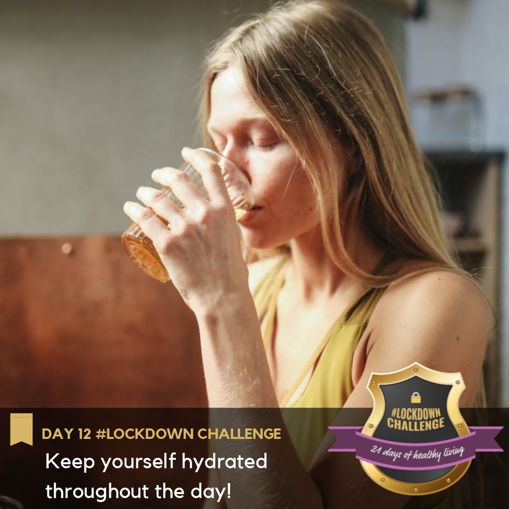 A girl drinking a glass of water