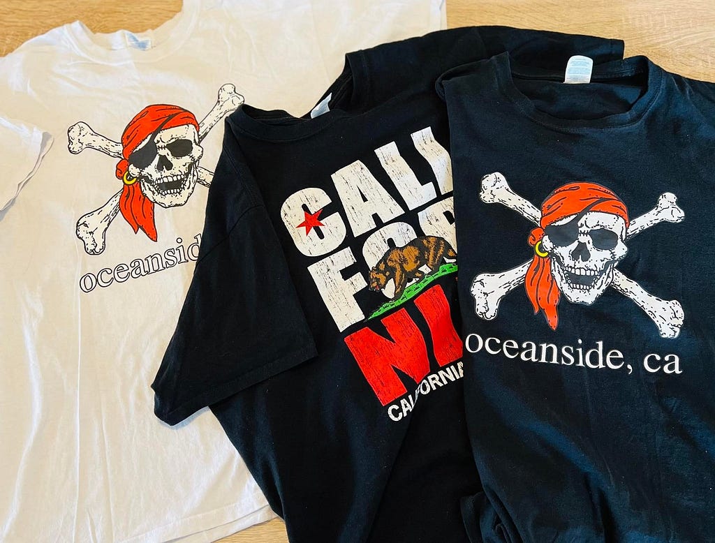 Three tourist T-shirts, 1 white 2 black, from Oceanside, California