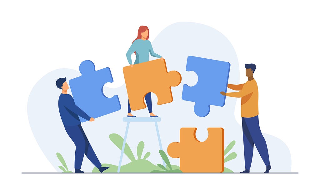Puzzle pieces assembled by a team of people. pch.vector / Freepik