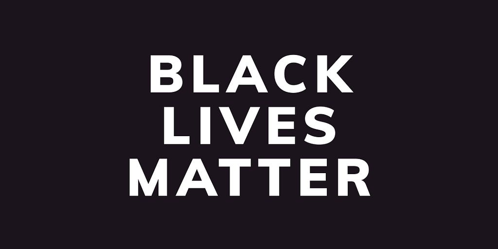 A poster that is black background with white text that says Black Lives Matter.
