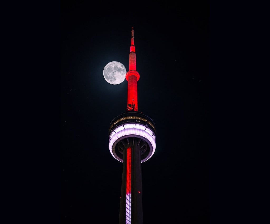 Low-angle Photography of Red and White Tower