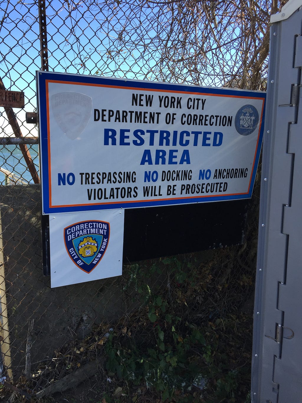 A sign of warning prior to entering the ferry that takes you to Hart Island. Photography by the Author.