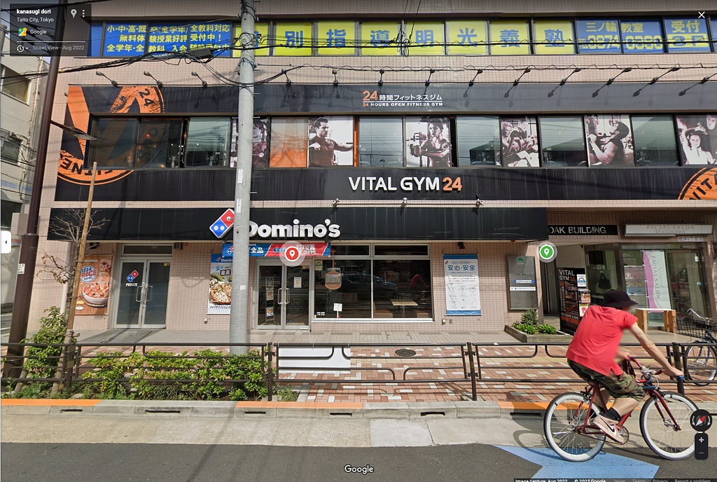 Google Maps Street View image showing Domino’s Pizza below a sports gym