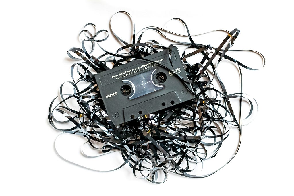 A cassette with strewn out tape.