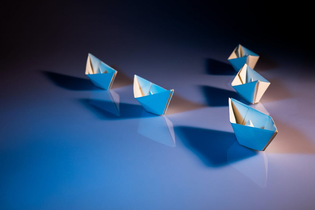 Origami boats in formation