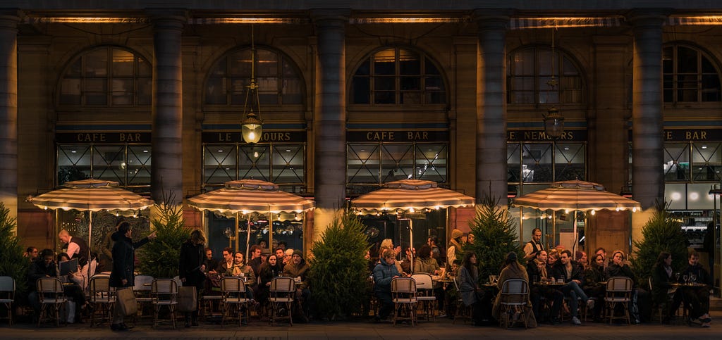 An outdoor cafe in the nighttime