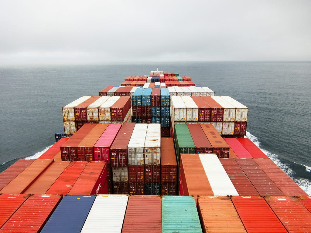 Large freight ship stacked with containers.