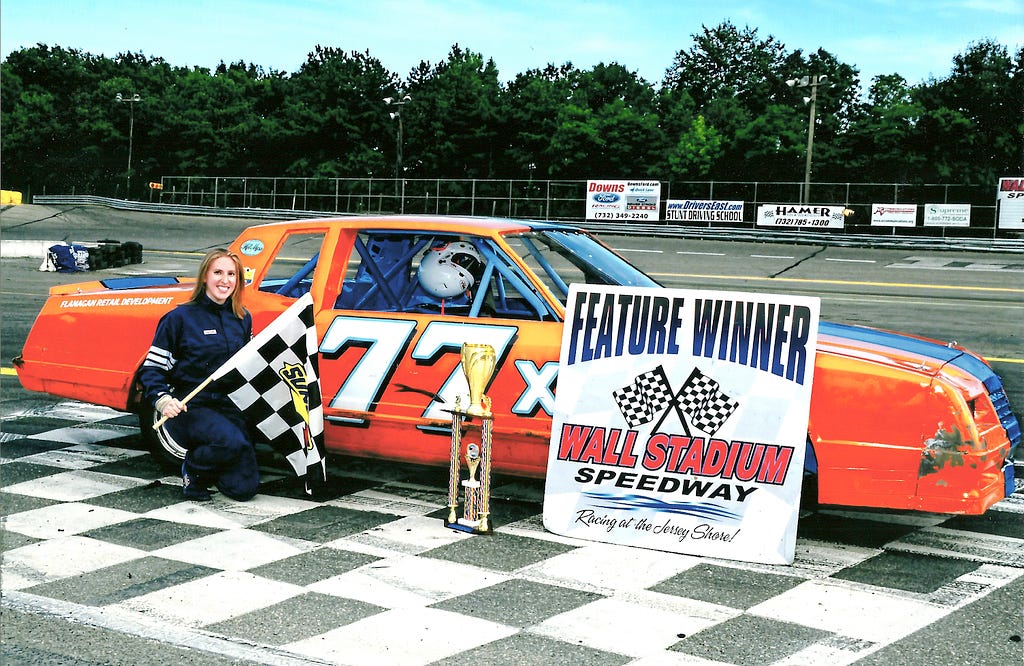 race car driver and stock car in victory lane