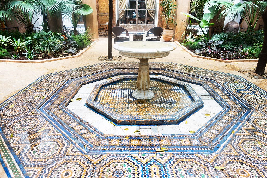 an intricate moroccan style tiled courtyard