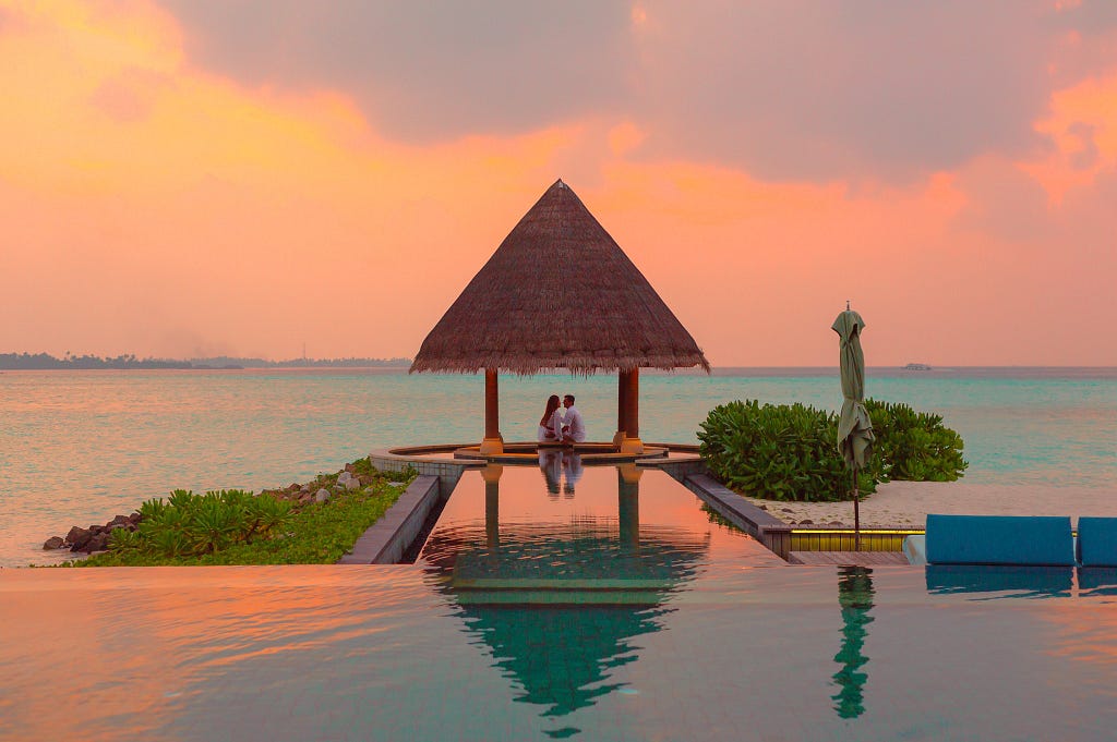 Couple Under Hut Beside Sea and Infinity Pool. Picture is used because love is necessary for emotional survival. Love and affection keeps the person emotionally stable. True love heals. Let’s be mentally and emotionally stable.