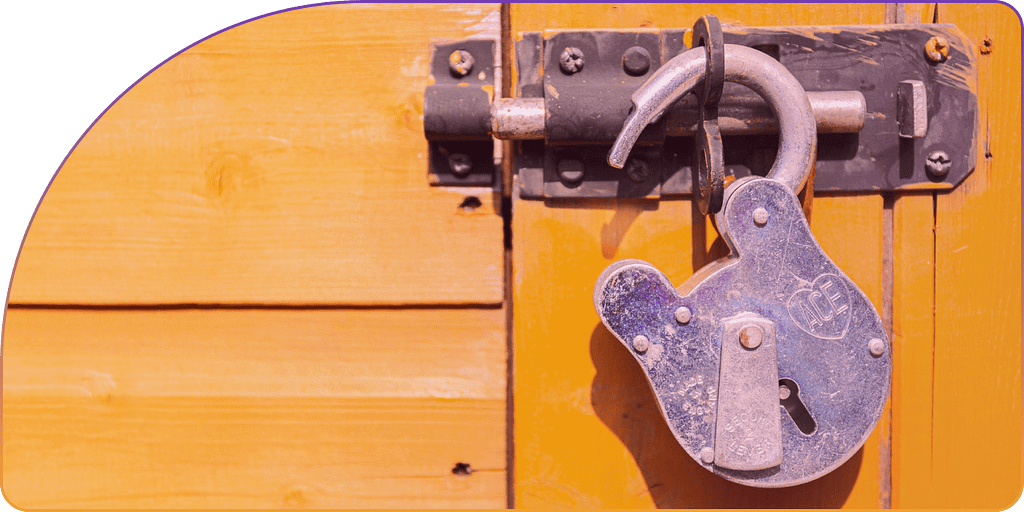 Yellow door with an open padlock