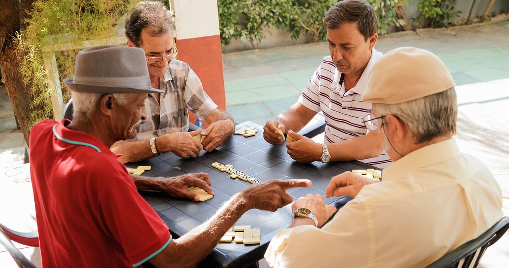 Retirees play dominoes together