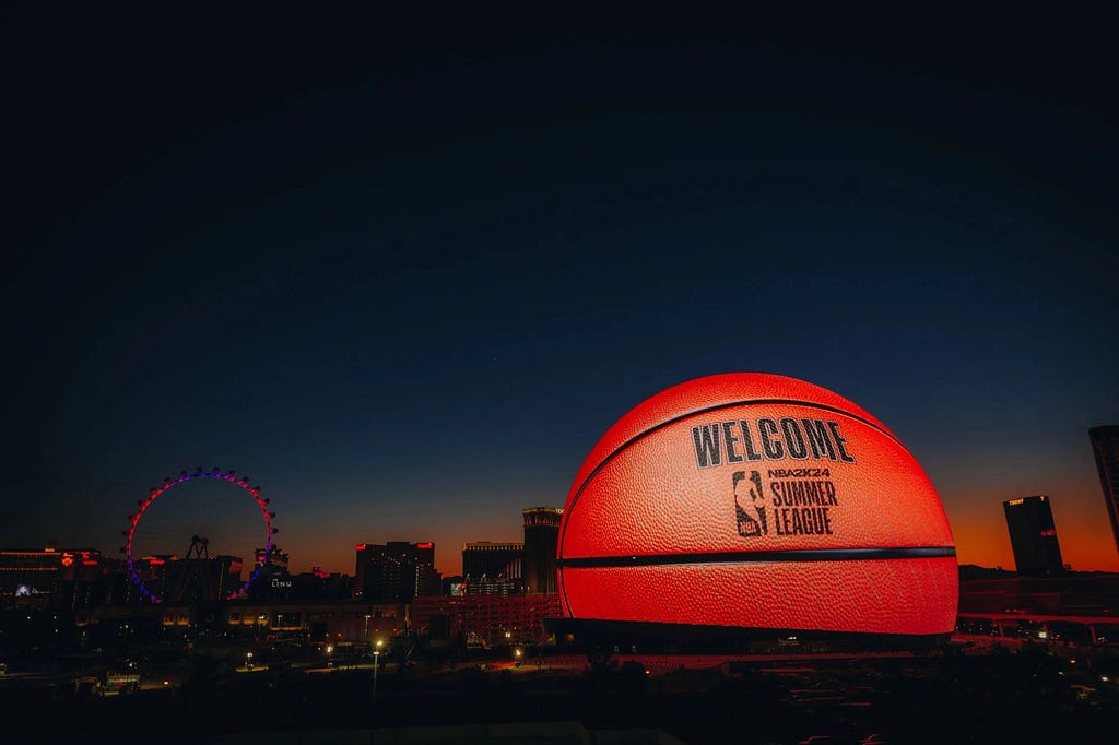 A shot showing The Sphere in the Las Vegas skyline, lit up as a basketball for the NBA Summer League