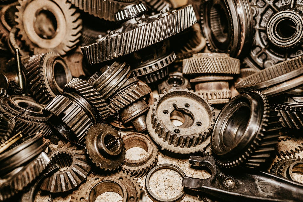 Photograph of many small gears in a pile