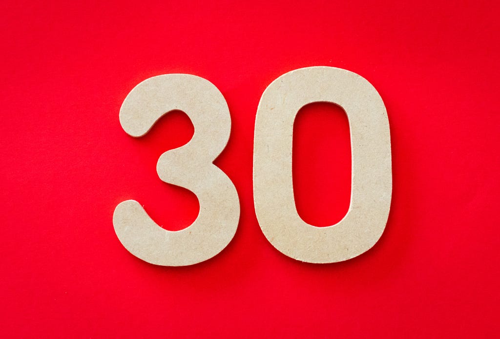 Image of the number “30” on a red background.